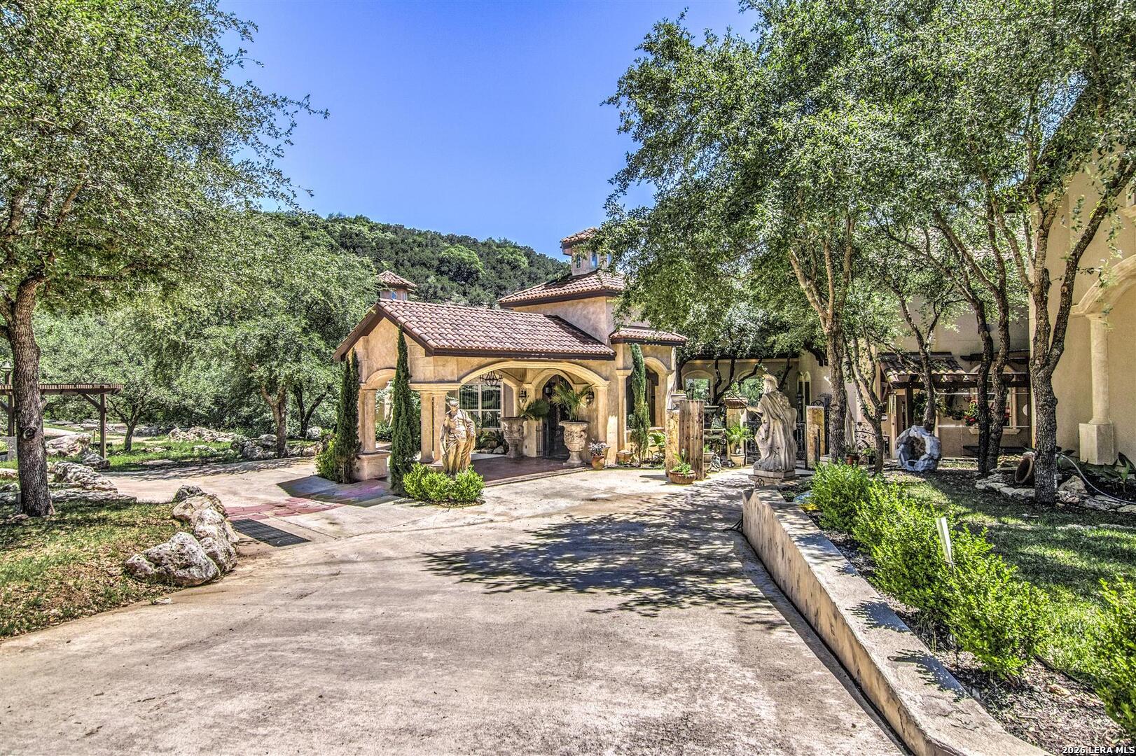 9469 Canyon Mist Helotes, TX 78023 - Photo 8 of 50 a view of a house with a snow in the yard