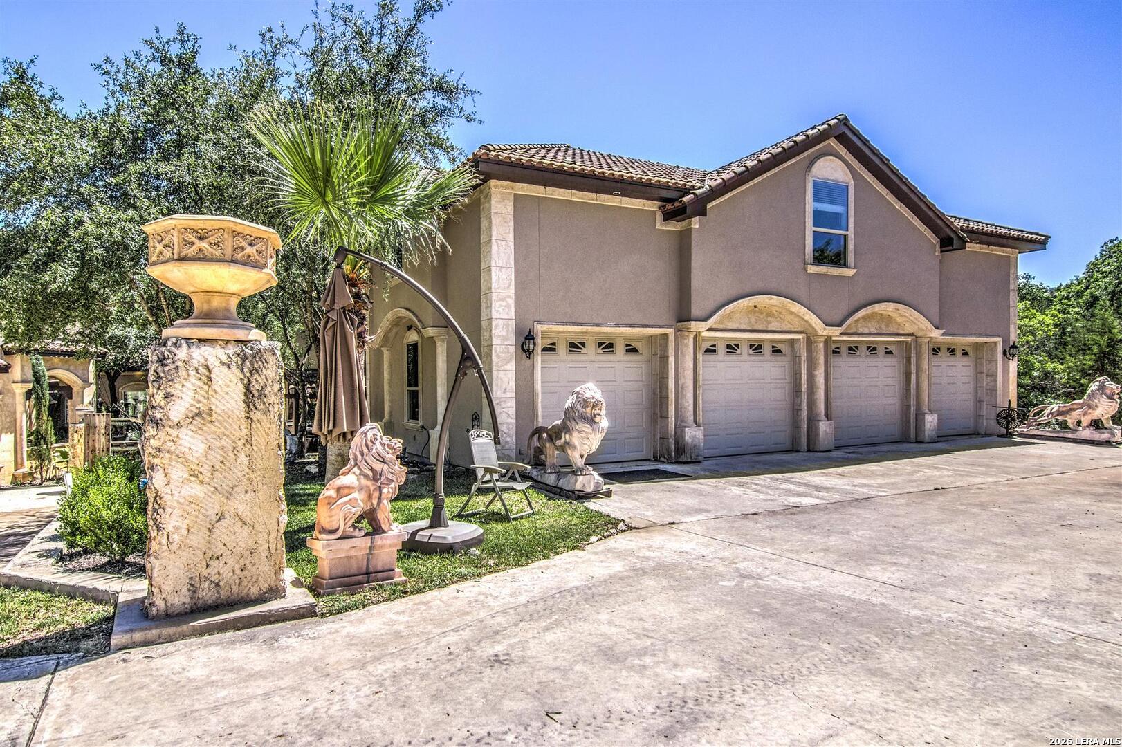 9469 Canyon Mist Helotes, TX 78023 - Photo 9 of 50 a front view of a house with garden
