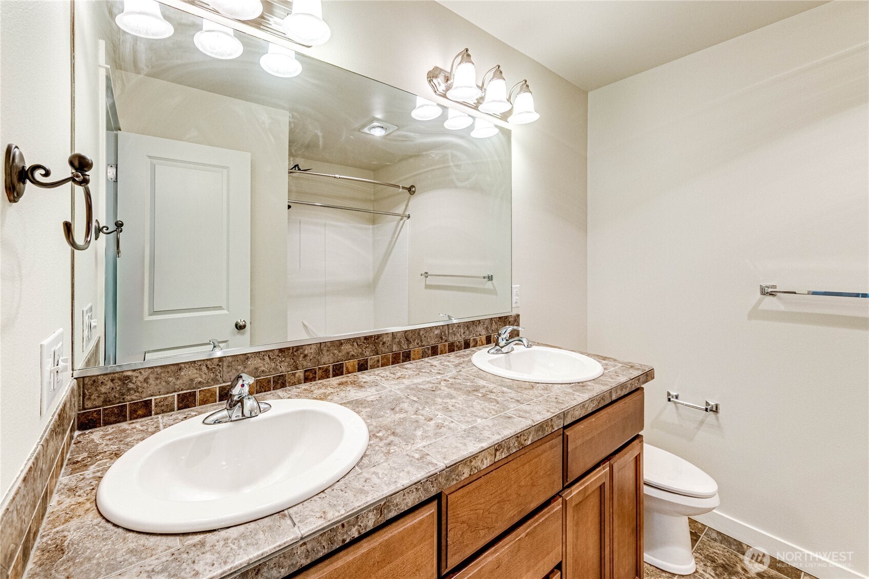 21914 78th Place West Edmonds, WA 98026 - Photo 21 of 39 a bathroom with a granite countertop double vanity sinks and a mirror