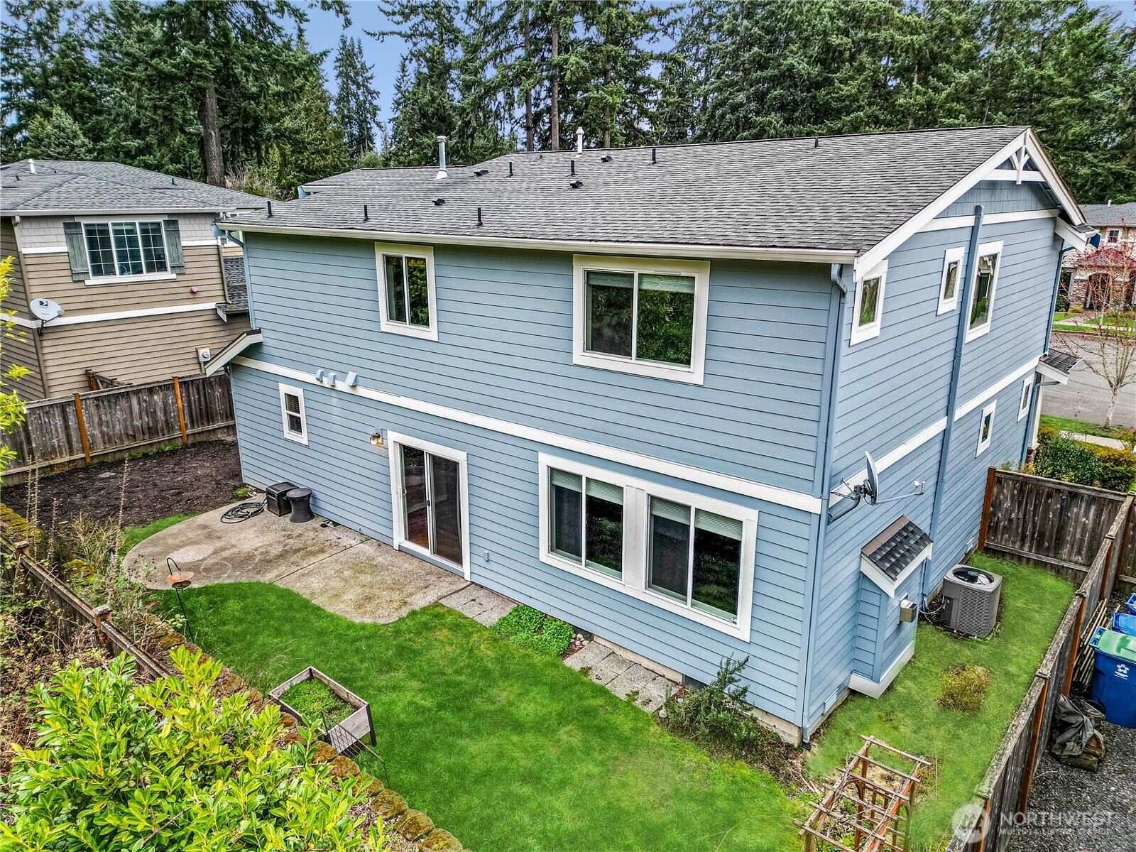 21914 78th Place West Edmonds, WA 98026 - Photo 28 of 39 a aerial view of a house with a yard table and chairs