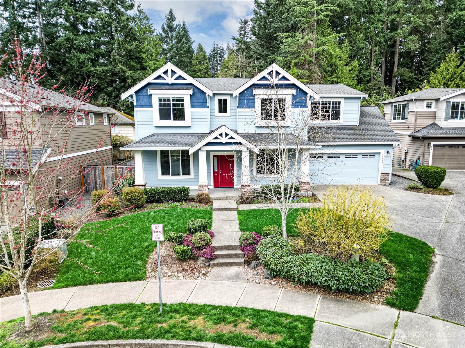21914 78th Place West Edmonds, WA 98026 - Photo 32 of 39 a front view of a house with a yard and potted plants