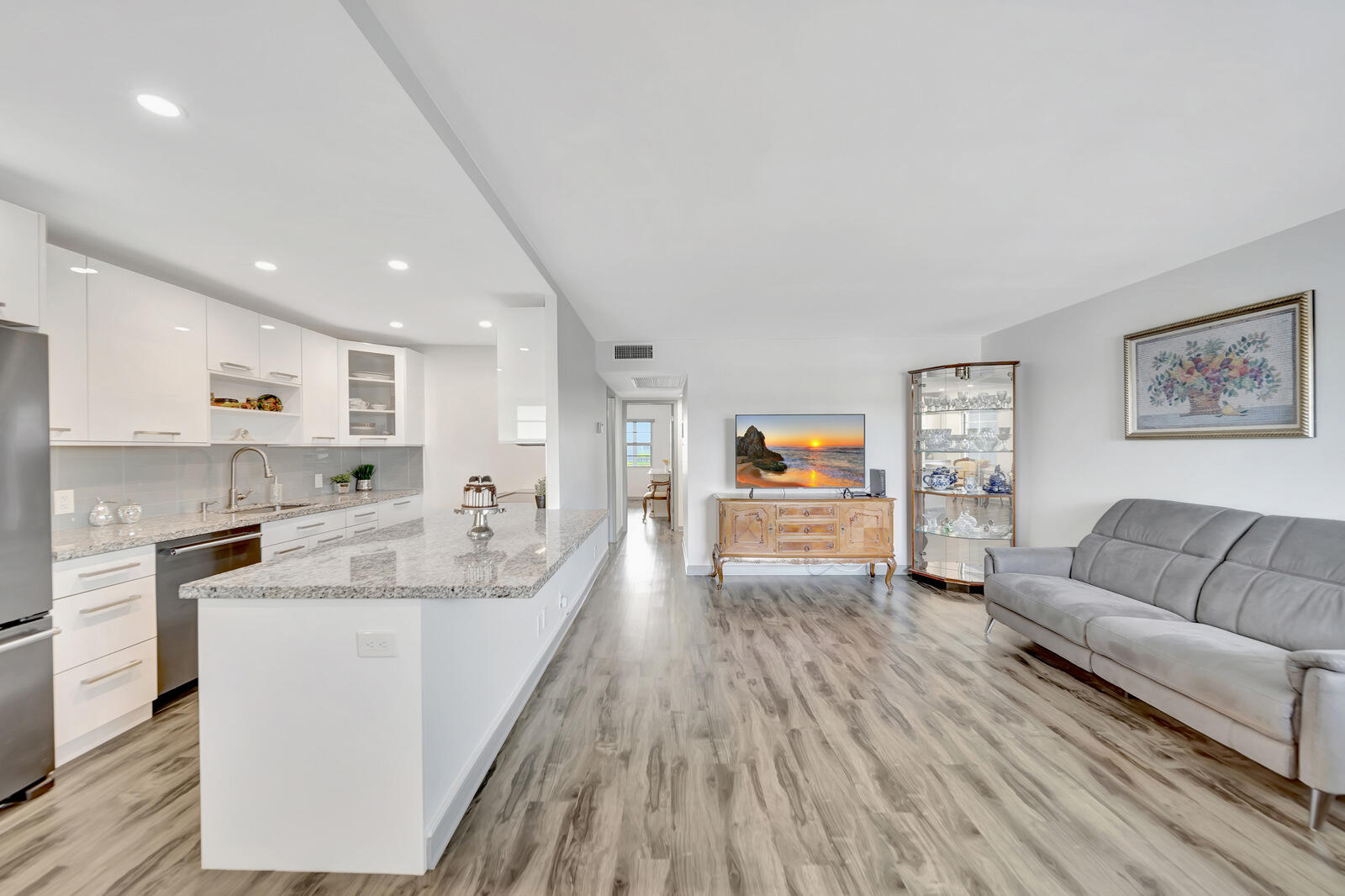 4063 Exeter Boca Raton, FL 33434 - Photo 4 of 55 a large living room with stainless steel appliances granite countertop a couch and a couch
