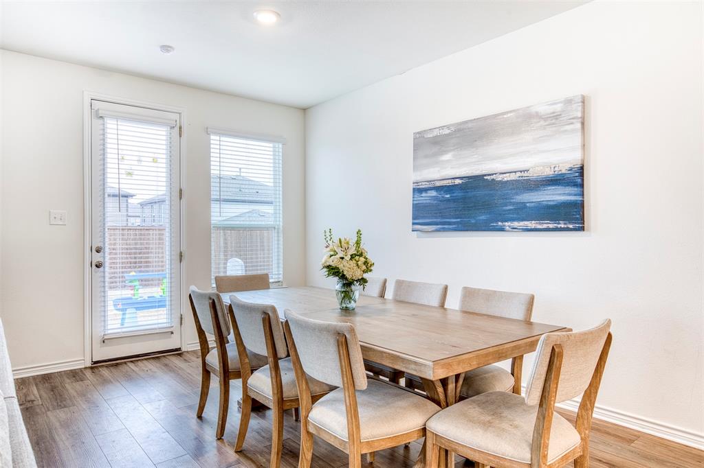2513 Wayne Avenue Aubrey, TX 76227 - Photo 15 of 27 a dining room with furniture and wooden floor