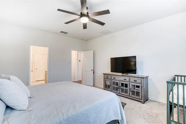 a bathroom with a granite countertop sink and mirror