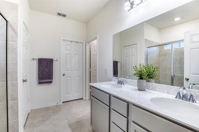 a bathroom with a tub and shower