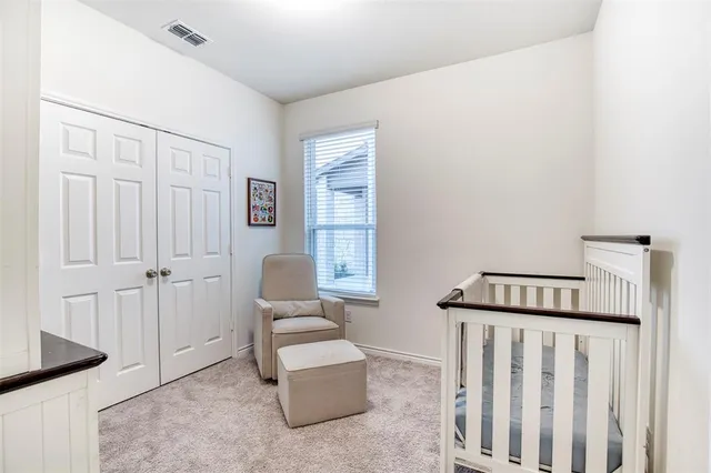 a bathroom with a double vanity sink toilet and mirror