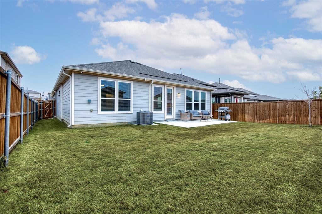 2513 Wayne Avenue Aubrey, TX 76227 - Photo 27 of 27 a view of a house with backyard and balcony