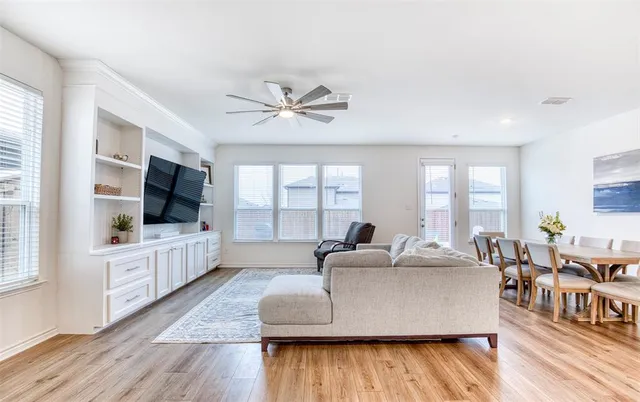 a living room with furniture fireplace and flat screen tv