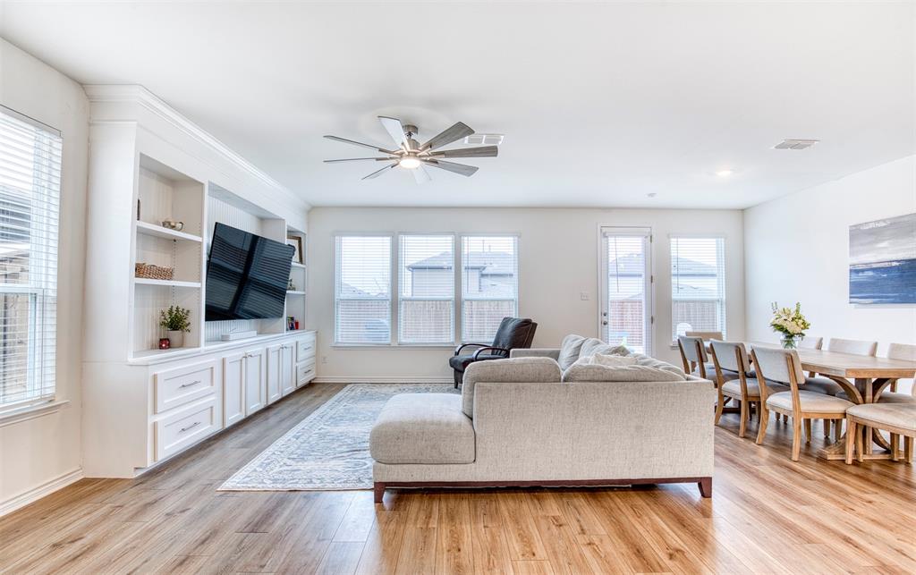 2513 Wayne Avenue Aubrey, TX 76227 - Photo 5 of 27 a living room with furniture and a flat screen tv