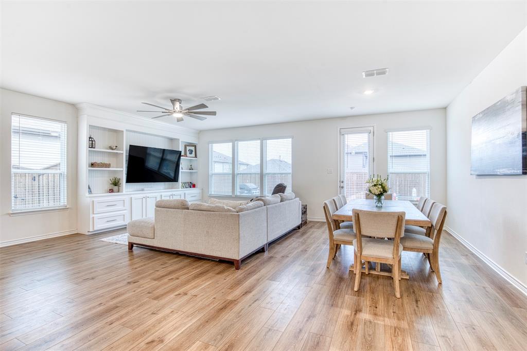 2513 Wayne Avenue Aubrey, TX 76227 - Photo 6 of 27 a living room with furniture fireplace and flat screen tv