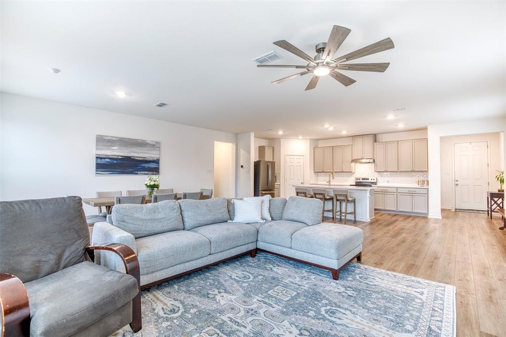 2513 Wayne Avenue Aubrey, TX 76227 - Photo 7 of 27 a living room with furniture and view of kitchen