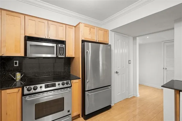 a view of kitchen and wooden floor