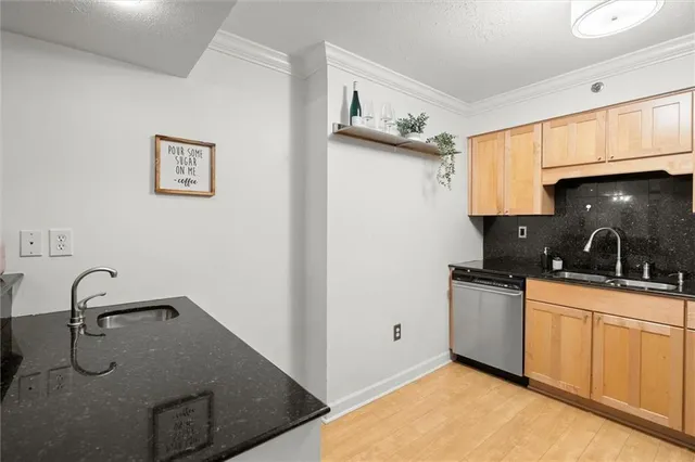a living room with furniture a flat screen tv and a window