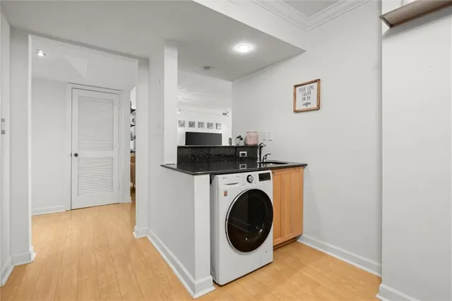 a living room with furniture a rug and a flat screen tv