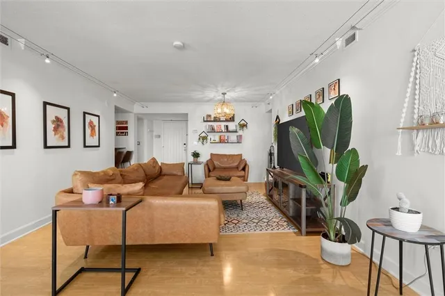 a view of a dining room with a table and chairs