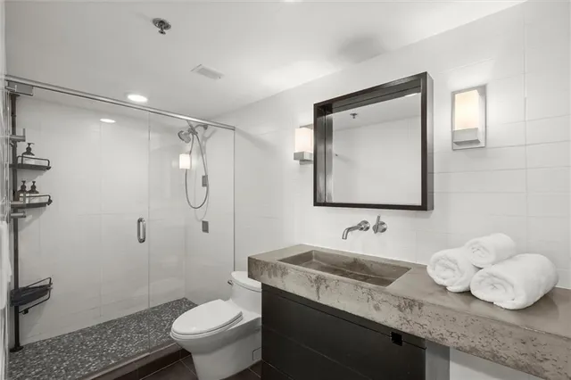 a bedroom with furniture and a flat screen tv