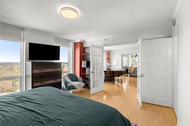 a bathroom with a granite countertop sink a toilet and shower