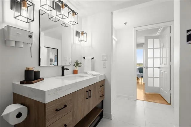 a lobby with furniture and a chandelier