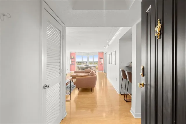 a kitchen with granite countertop cabinets stainless steel appliances and wooden floor