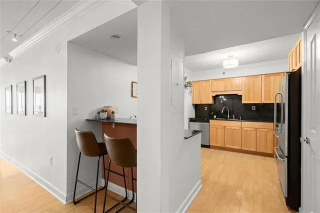a kitchen with a refrigerator stove and microwave
