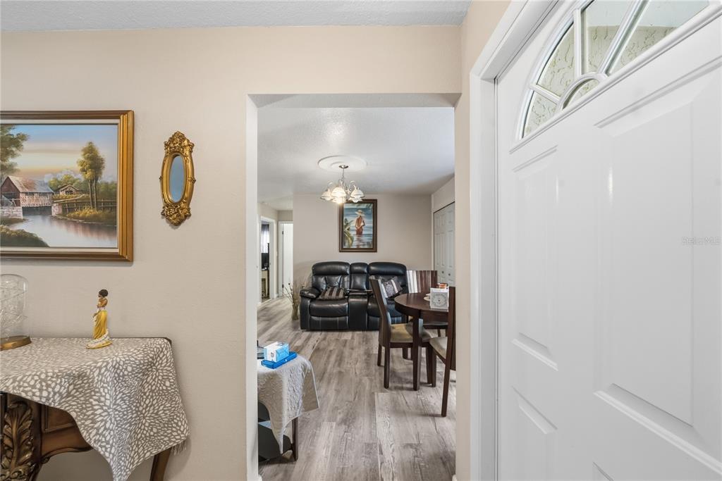 2507 Bluegrass Street Inverness, FL 34453 - Photo 12 of 30 a bedroom with furniture and wooden floor