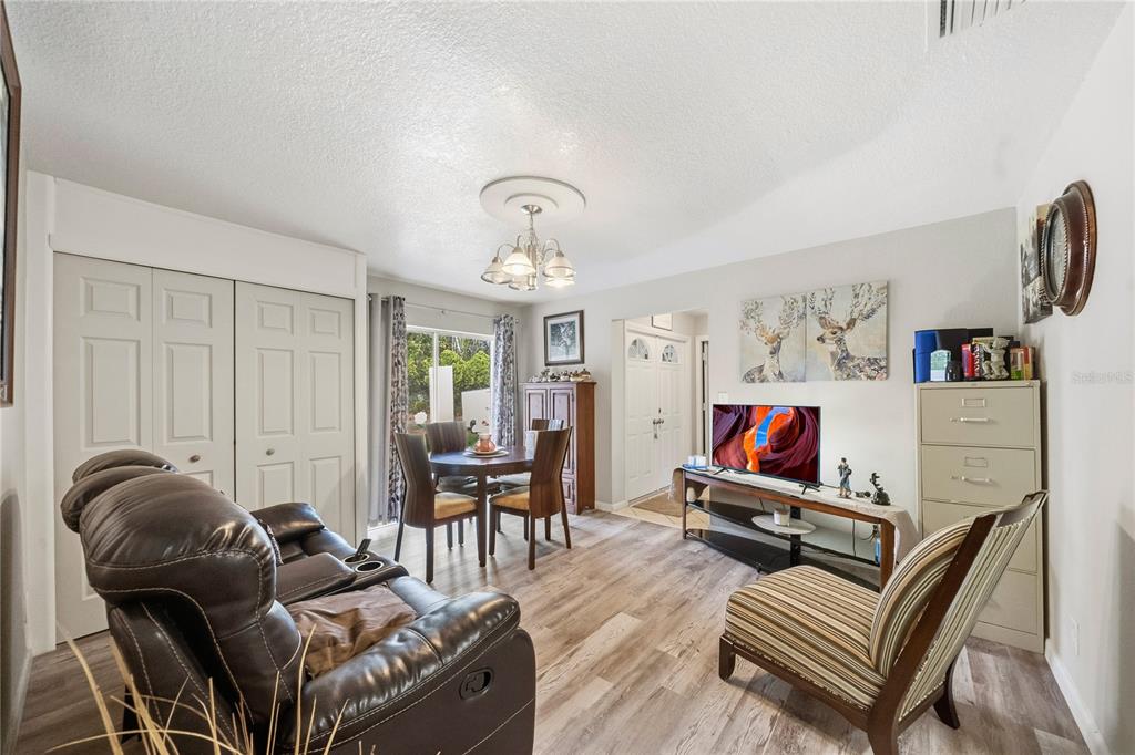 2507 Bluegrass Street Inverness, FL 34453 - Photo 13 of 30 a living room with furniture and a piano
