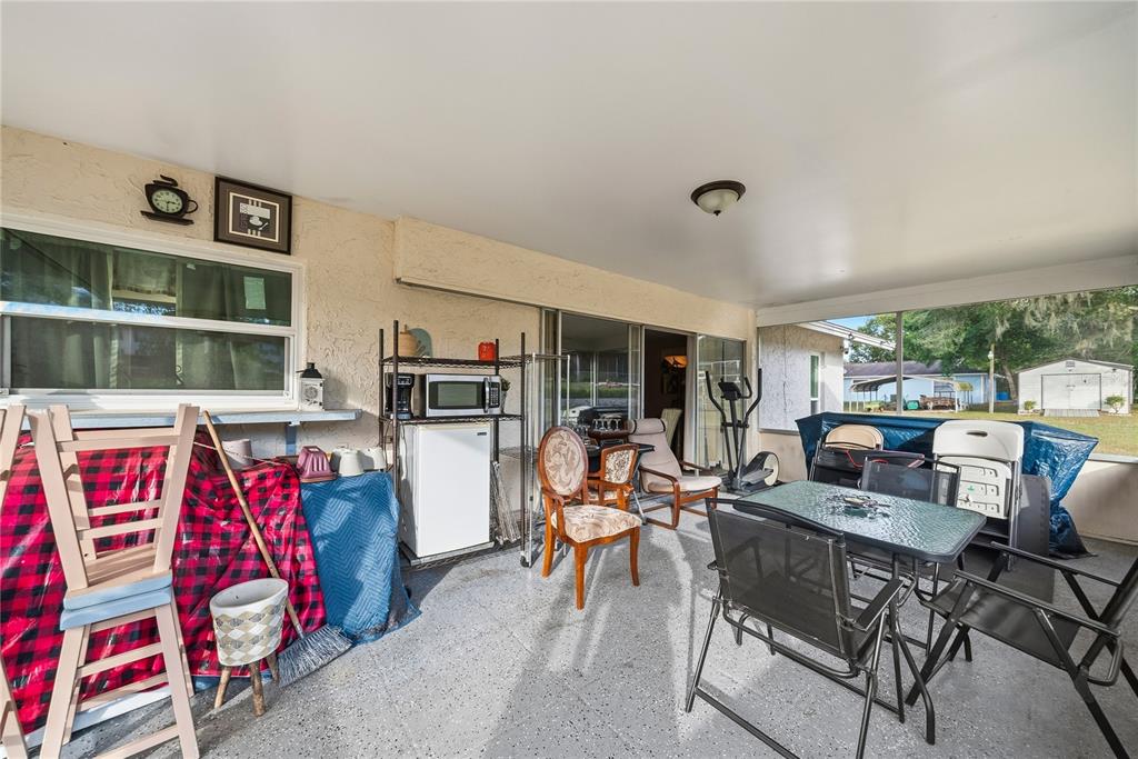 2507 Bluegrass Street Inverness, FL 34453 - Photo 26 of 30 a living room with furniture cabinets and a window