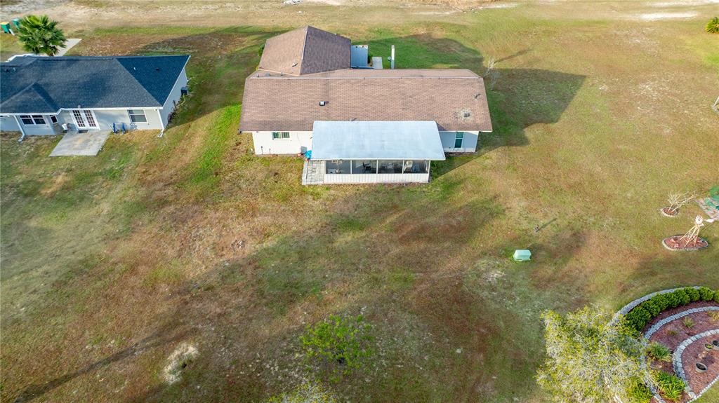 2507 Bluegrass Street Inverness, FL 34453 - Photo 27 of 30 an aerial view of a house with a yard