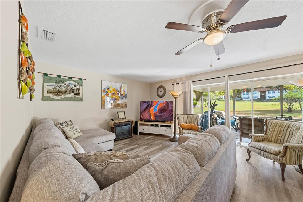 2507 Bluegrass Street Inverness, FL 34453 - Photo 6 of 30 a living room with furniture and a large window