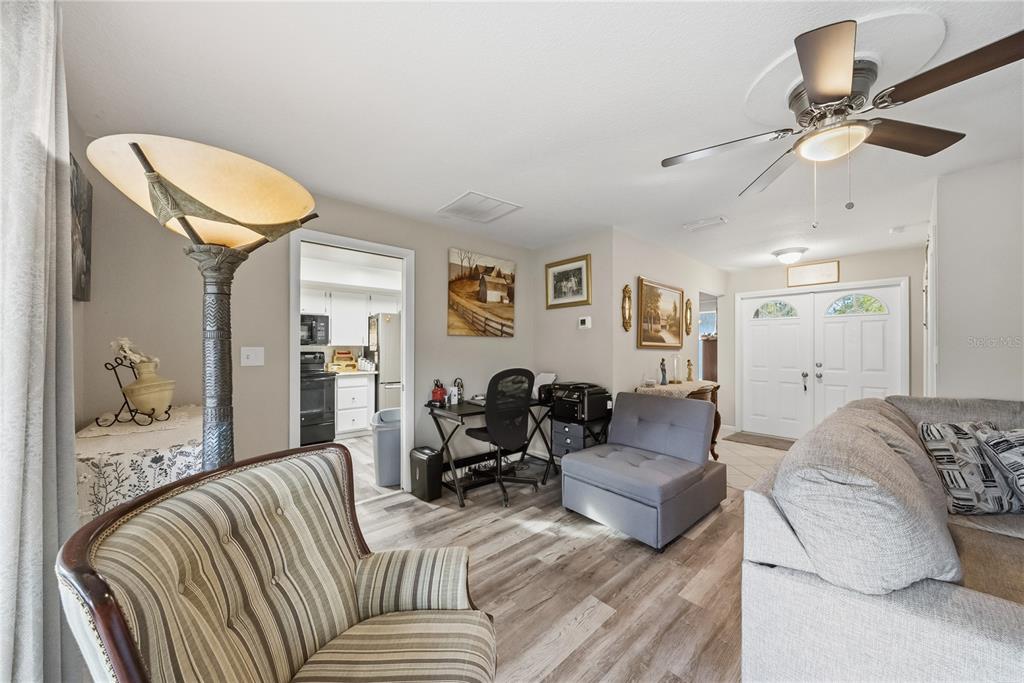 2507 Bluegrass Street Inverness, FL 34453 - Photo 9 of 30 a living room with furniture and a couch