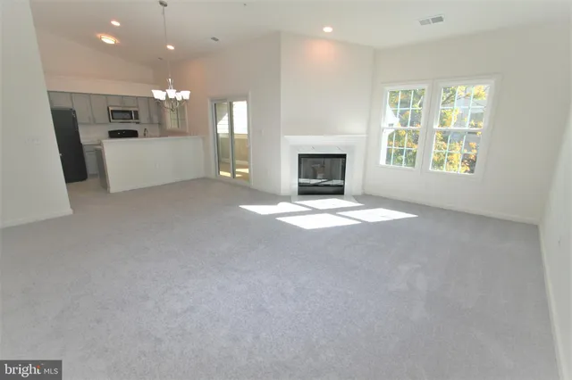 a utility room with a fireplace and a painting on the wall
