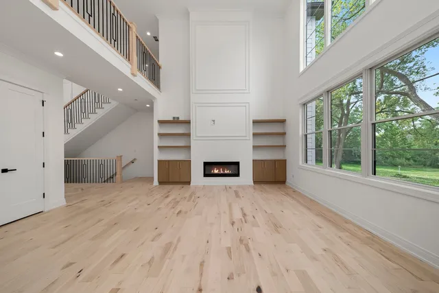a kitchen with kitchen island granite countertop a sink cabinets and window