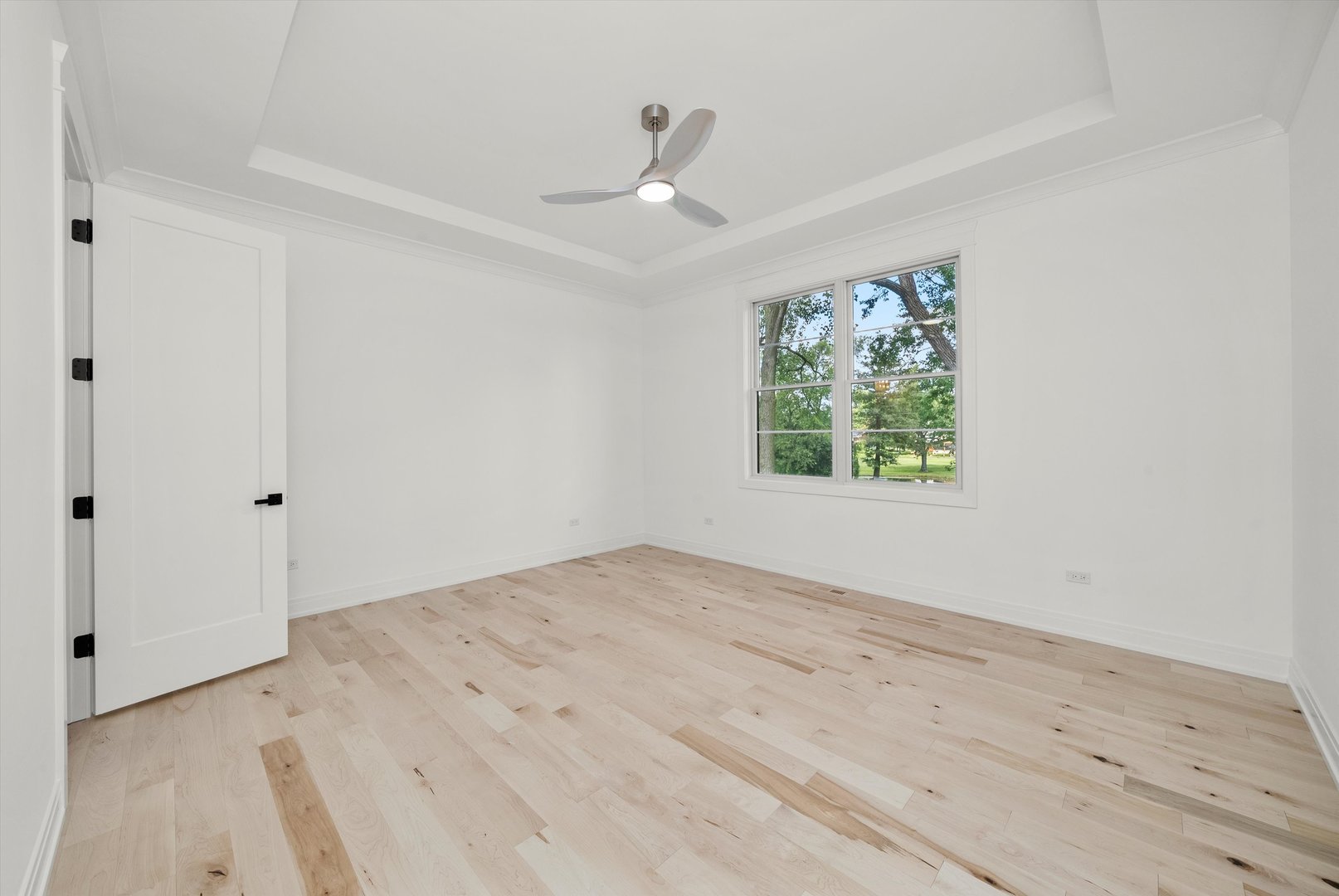 15W670 83rd Street Burr Ridge, IL 60527 - Photo 26 of 96 wooden floor in an empty room with a window