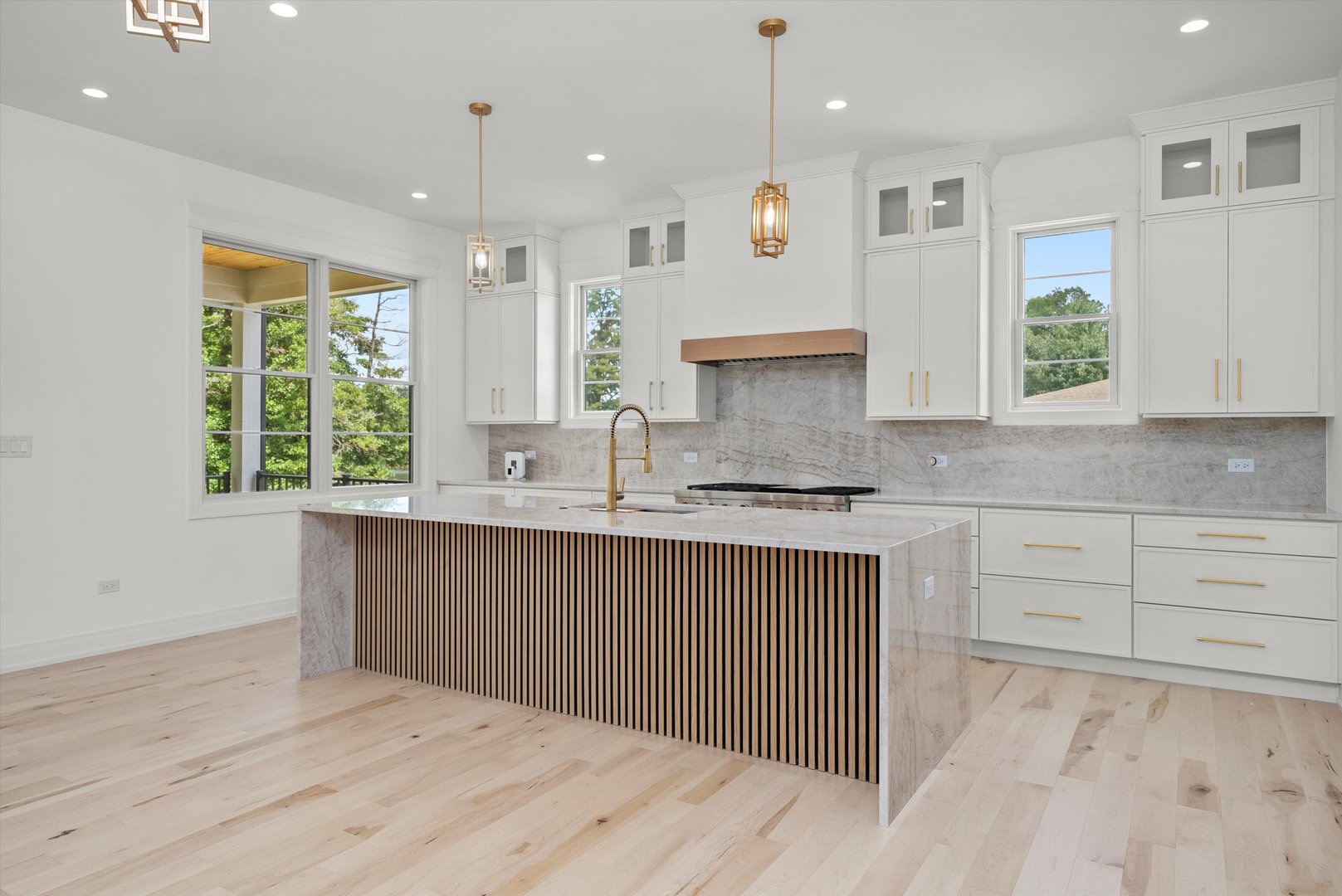 15W670 83rd Street Burr Ridge, IL 60527 - Photo 28 of 96 a kitchen with granite countertop a sink window and cabinets