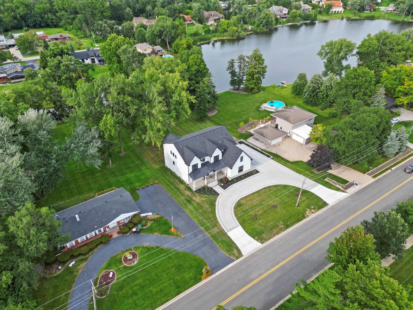 15W670 83rd Street Burr Ridge, IL 60527 - Photo 30 of 108 an aerial view of a house with outdoor space and lake view