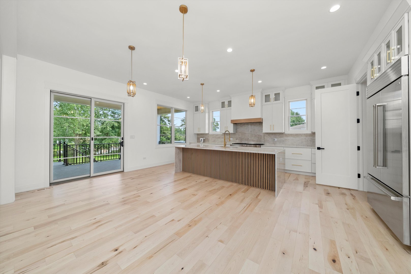 15W670 83rd Street Burr Ridge, IL 60527 - Photo 32 of 96 a large kitchen with a lot of counter space and wooden floor