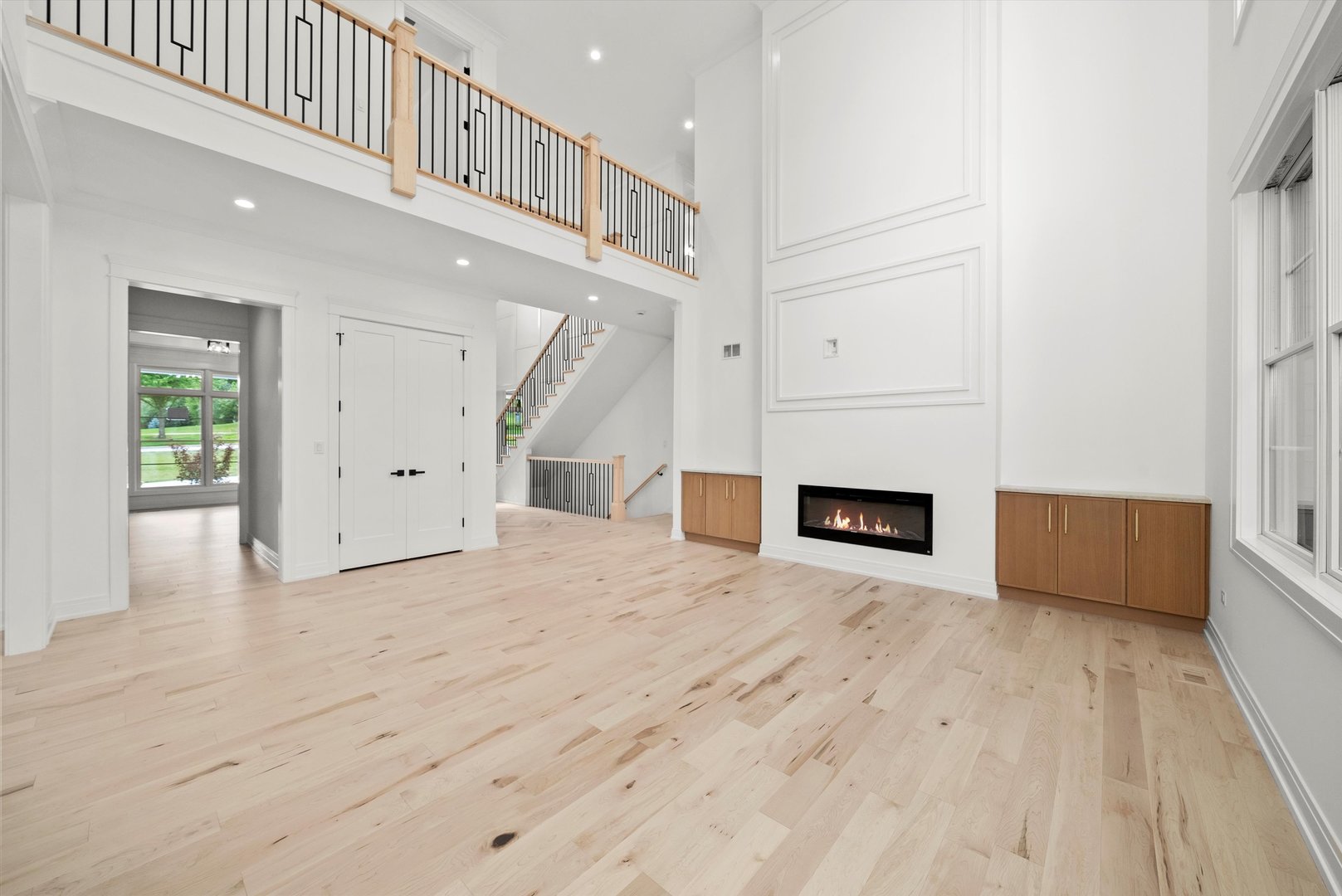15W670 83rd Street Burr Ridge, IL 60527 - Photo 36 of 96 a view of a livingroom with wooden floor and a kitchen space