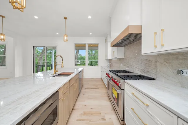 a utility room with sink dryer and washer