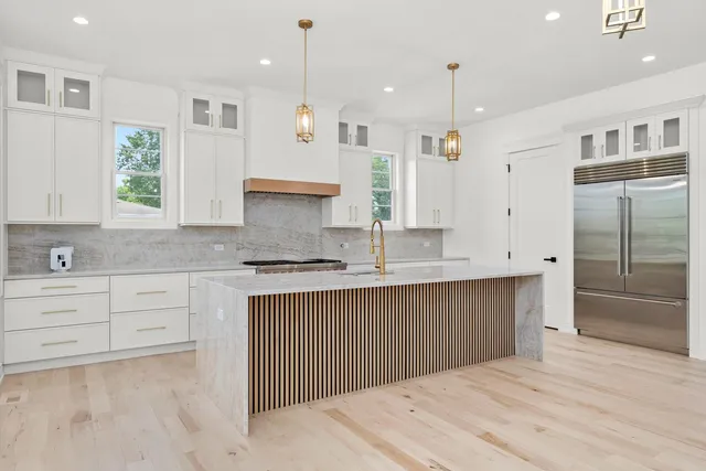 a bathroom with a double vanity sink and mirror