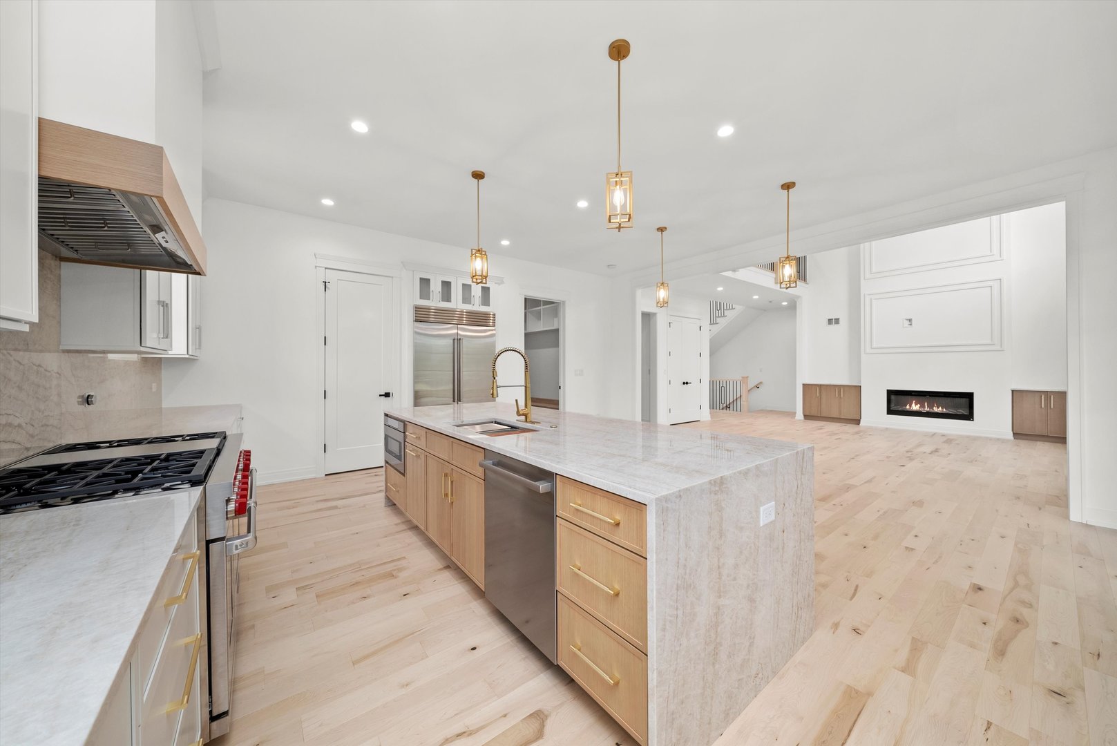 15W670 83rd Street Burr Ridge, IL 60527 - Photo 46 of 96 a large kitchen with stainless steel appliances kitchen island granite countertop a stove and a sink