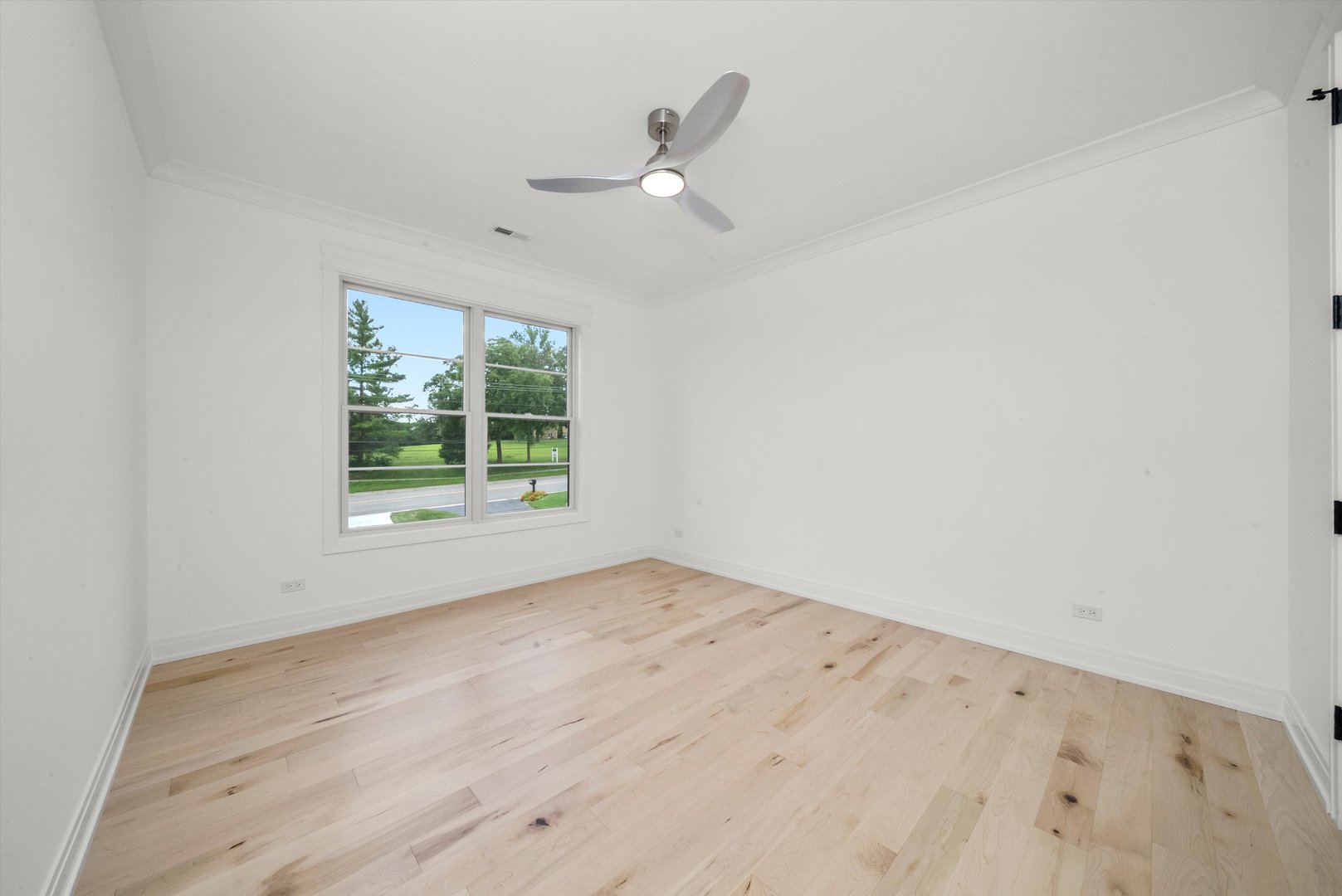15W670 83rd Street Burr Ridge, IL 60527 - Photo 47 of 96 an empty room with wooden floor and windows