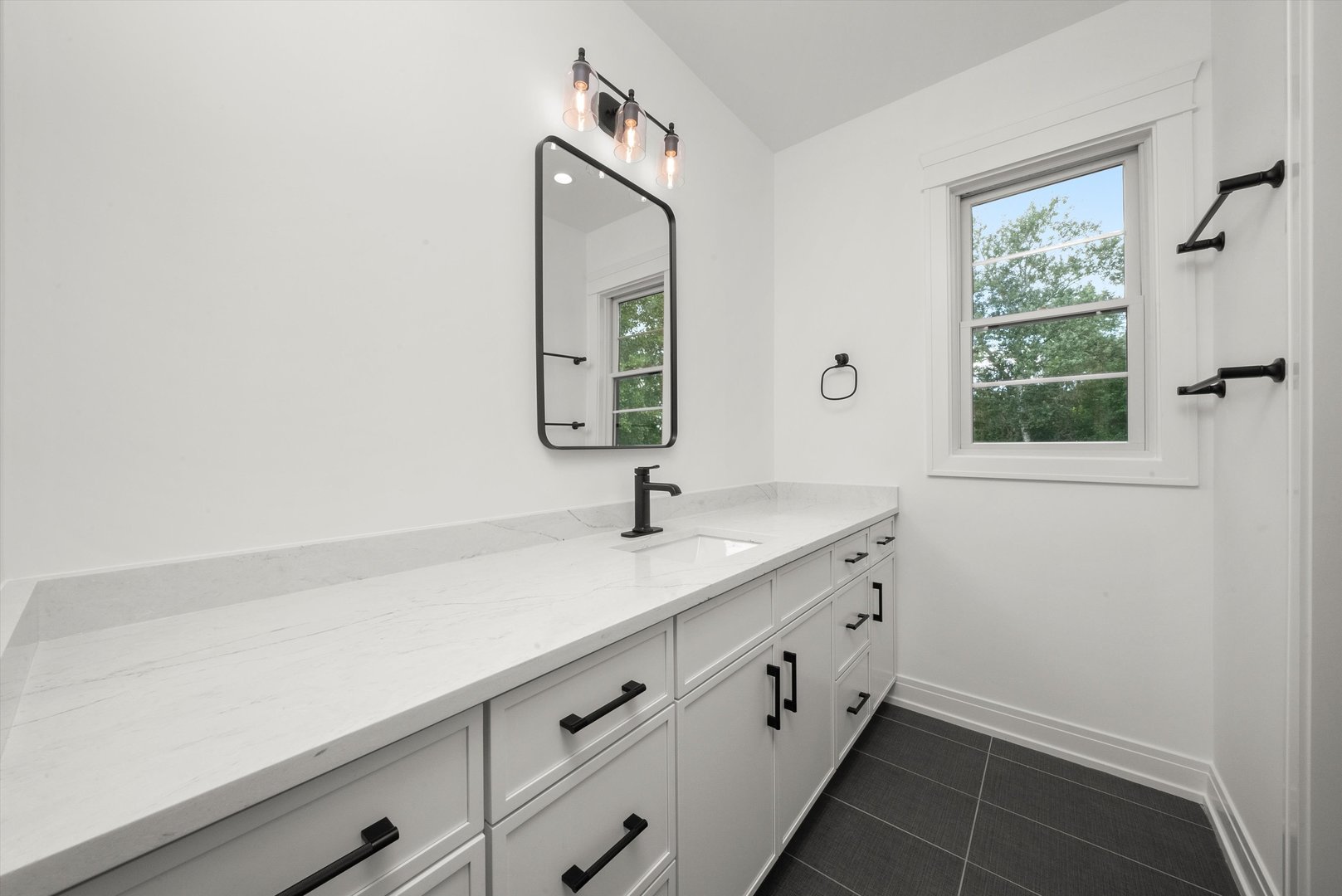 15W670 83rd Street Burr Ridge, IL 60527 - Photo 48 of 96 a bathroom with a sink and a mirror