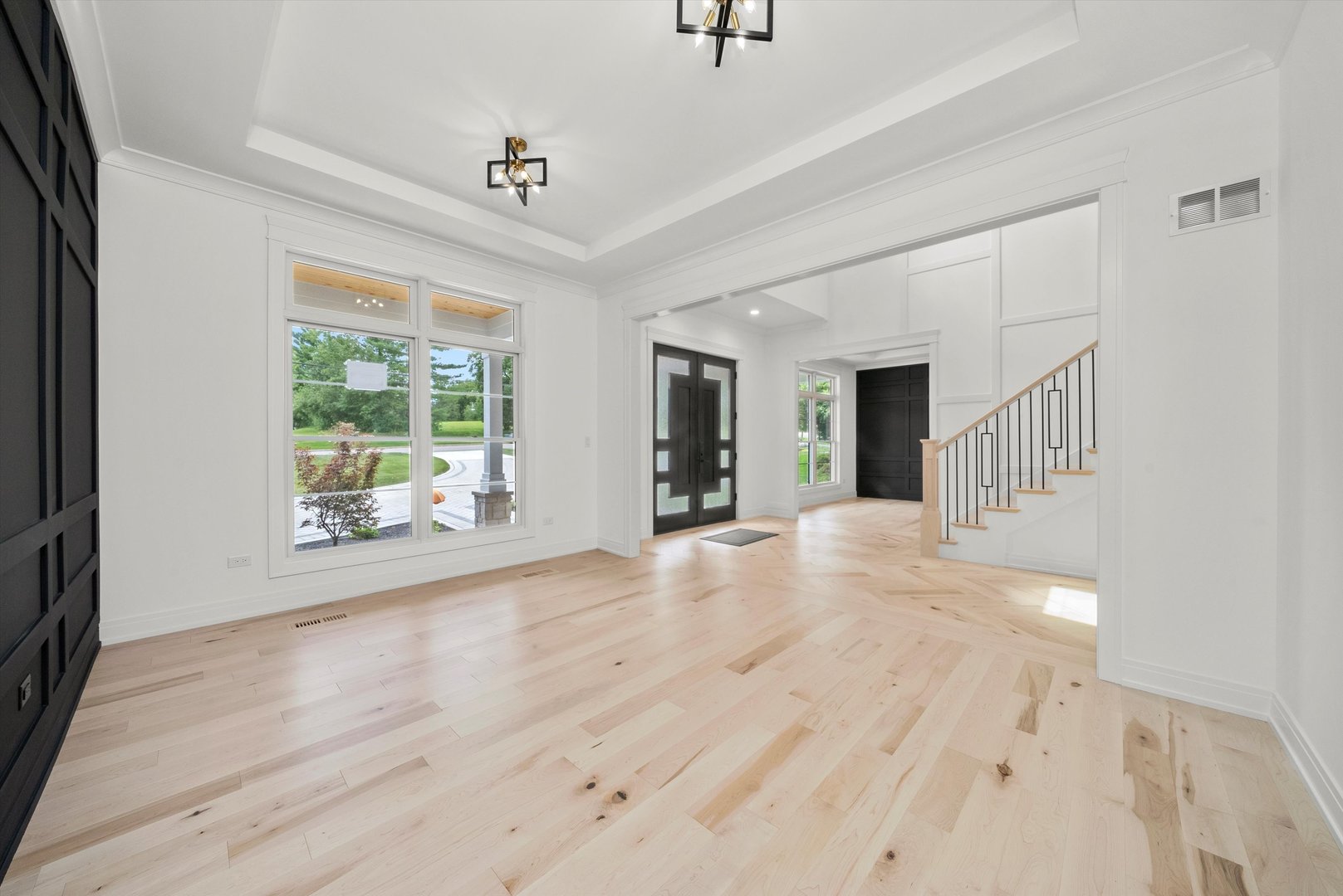 15W670 83rd Street Burr Ridge, IL 60527 - Photo 55 of 96 a view of an empty room with wooden floor and a window