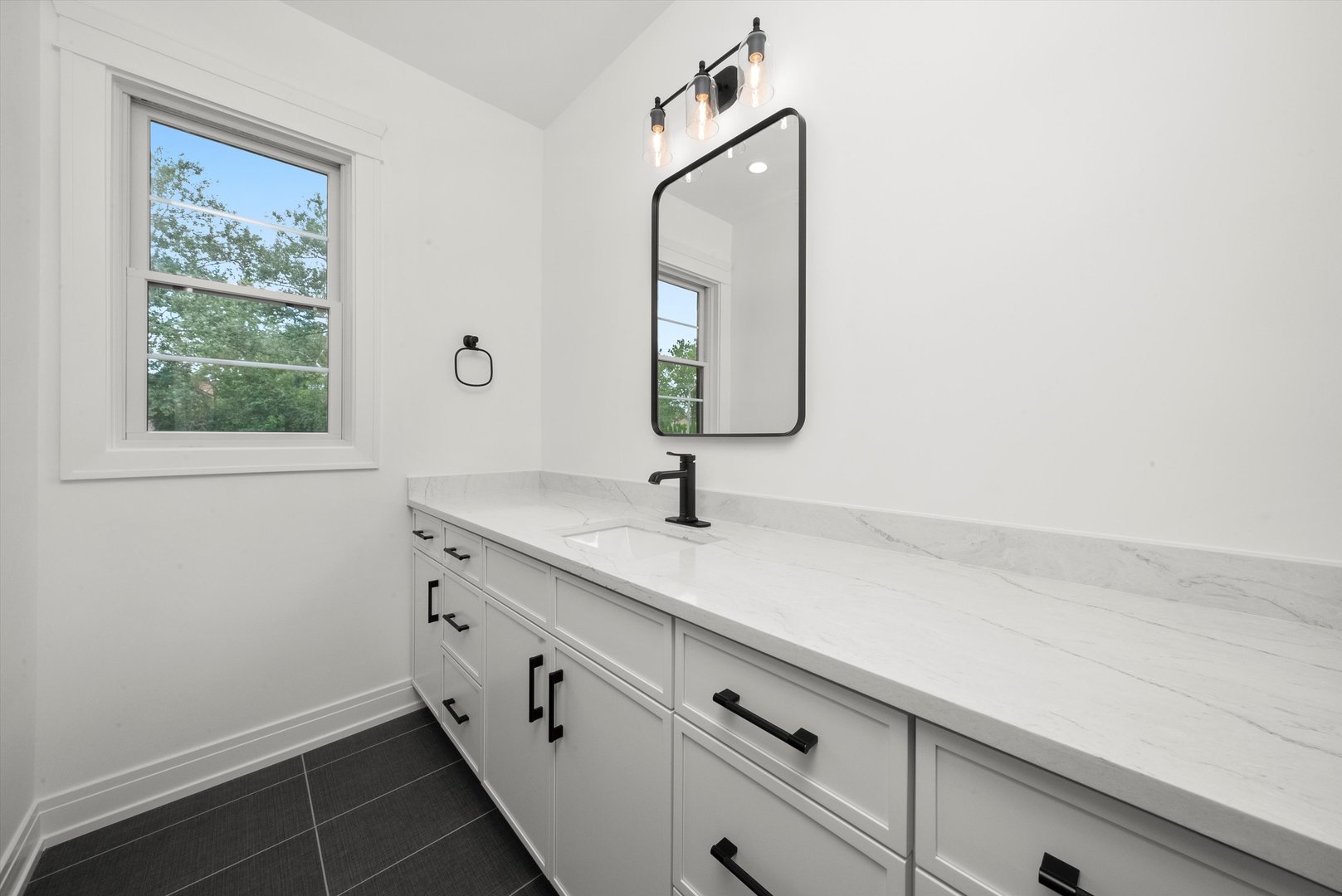 15W670 83rd Street Burr Ridge, IL 60527 - Photo 62 of 108 a bathroom with a sink and a mirror