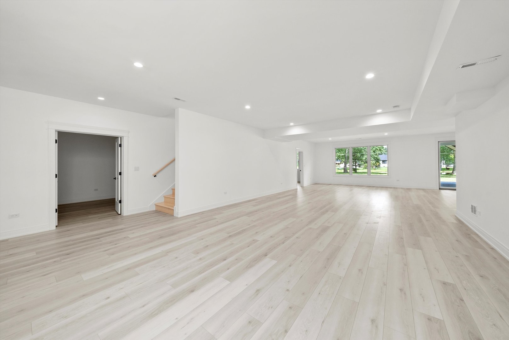 15W670 83rd Street Burr Ridge, IL 60527 - Photo 83 of 96 an empty room with wooden floor and windows