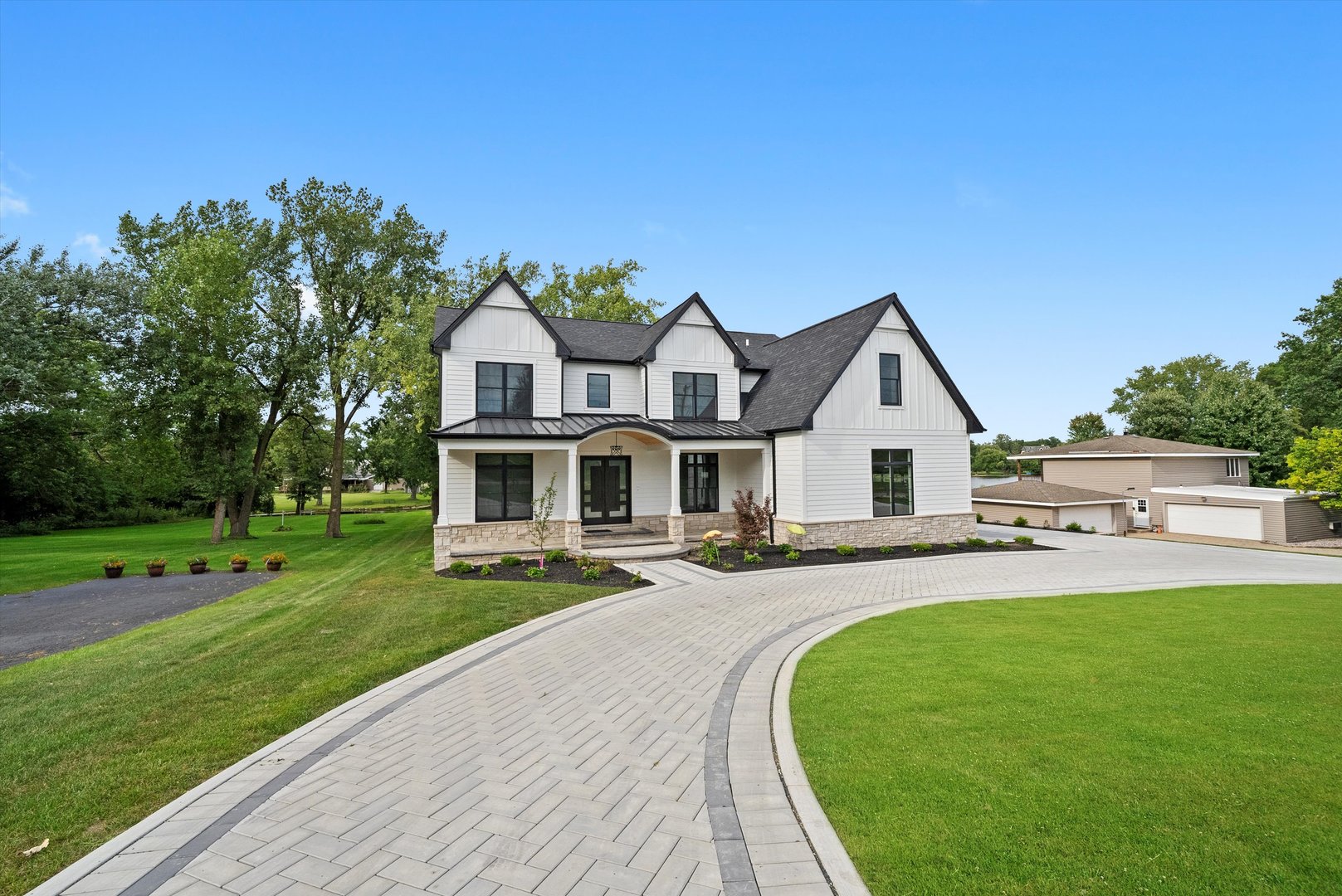 15W670 83rd Street Burr Ridge, IL 60527 - Photo 84 of 96 a front view of a house with a yard
