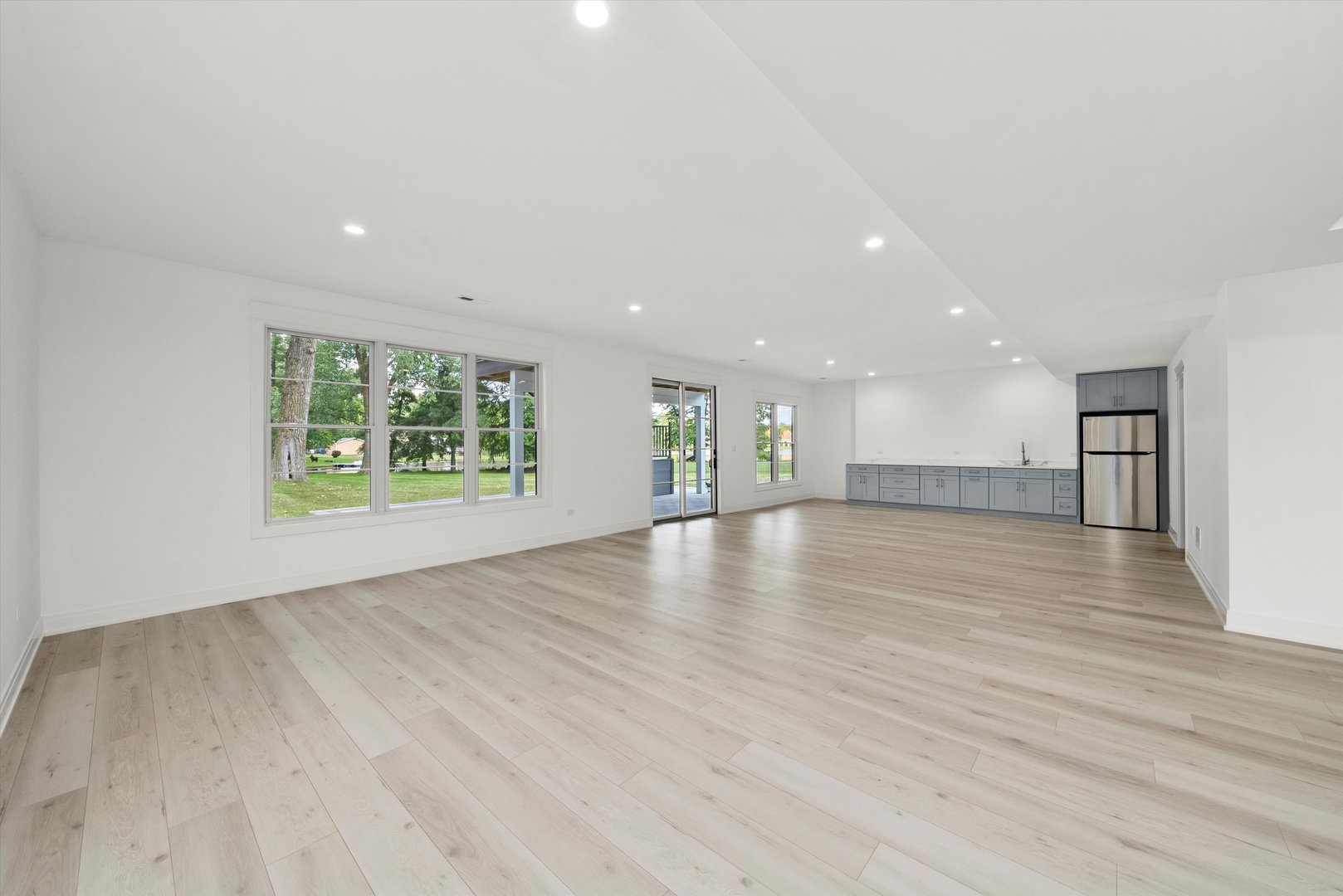 15W670 83rd Street Burr Ridge, IL 60527 - Photo 85 of 108 a view of an empty room with wooden floor and a window