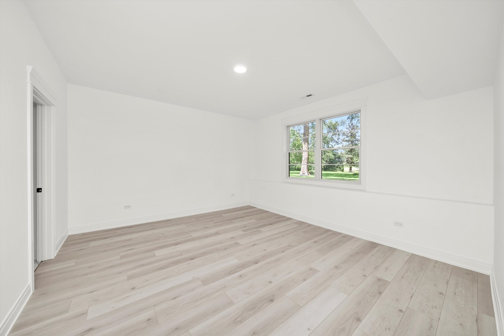 15W670 83rd Street Burr Ridge, IL 60527 - Photo 89 of 108 an empty room with wooden floor and windows