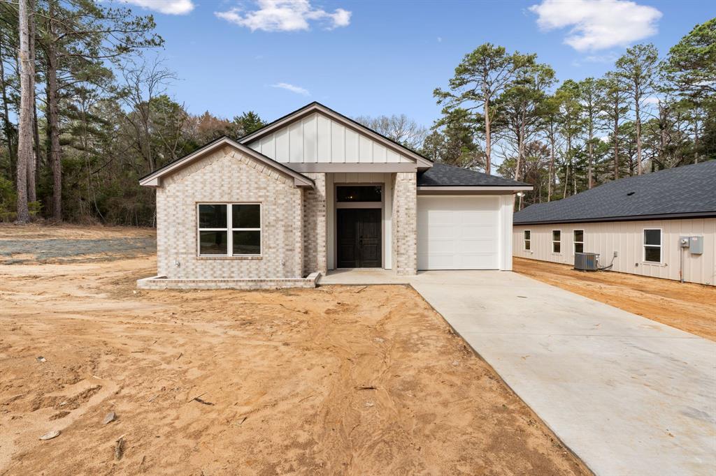 335 Perdanales Bullard, TX 75757 - Photo 3 of 37 a front view of a house with a yard and garage