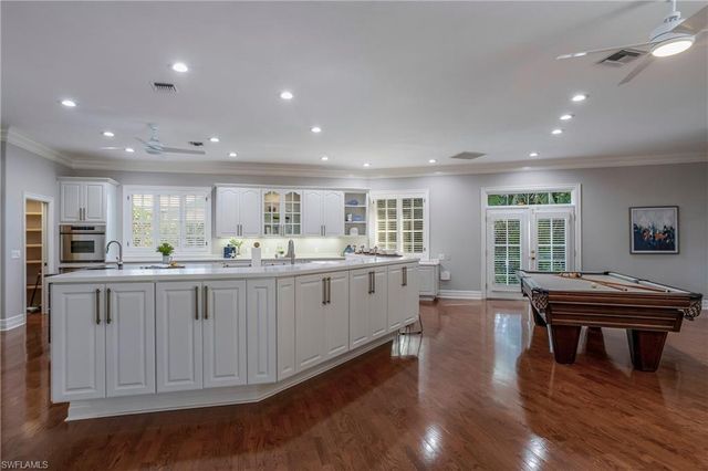 a kitchen with counter top space appliances and cabinets